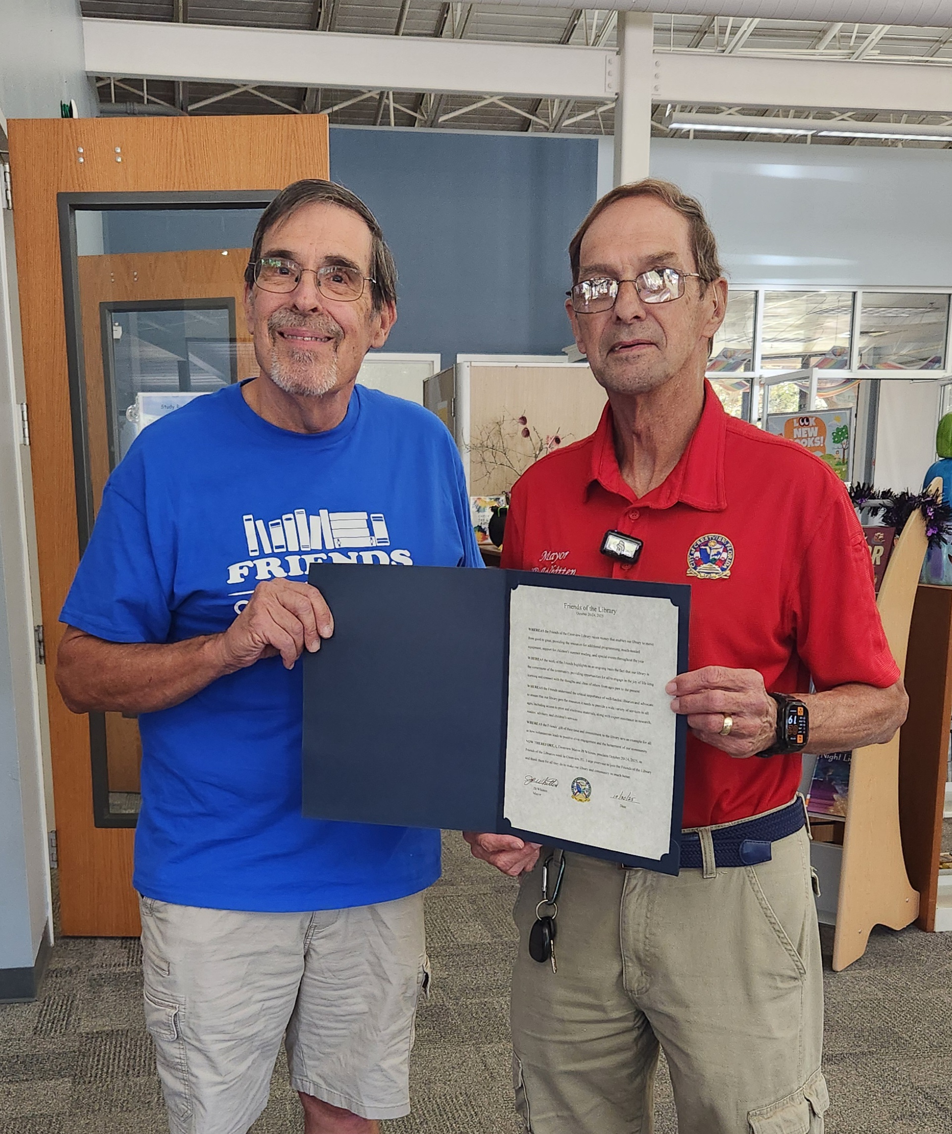 Friends of the Crestview Library President accepting a proclamation from Crestview Mayor